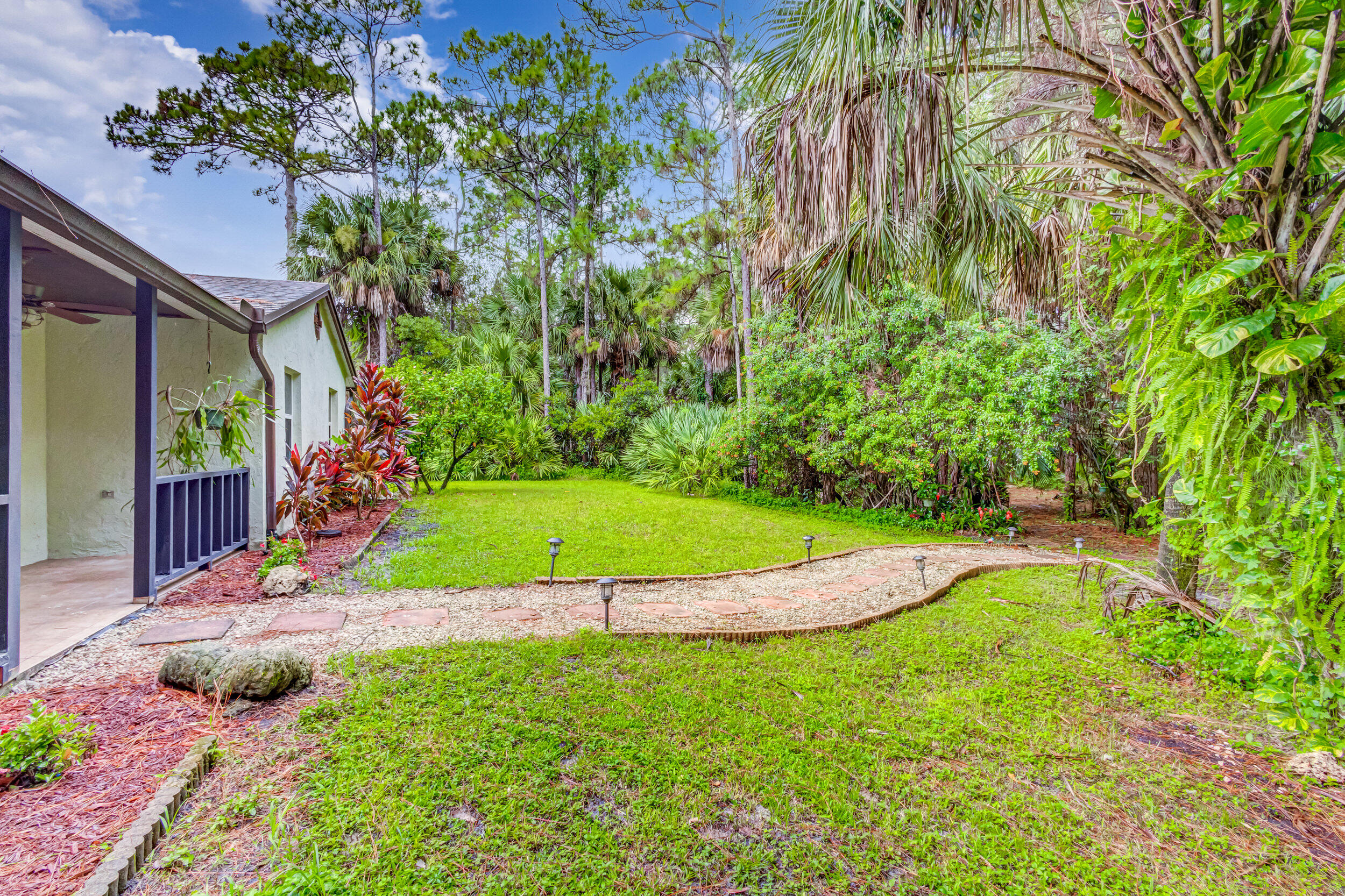 13578 Edith Road Loxahatchee Groves, FL 33470 - Photo 52 of 69 31 Ext Walkway to Front Parking