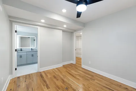 a bedroom with a bed and a view of bathroom