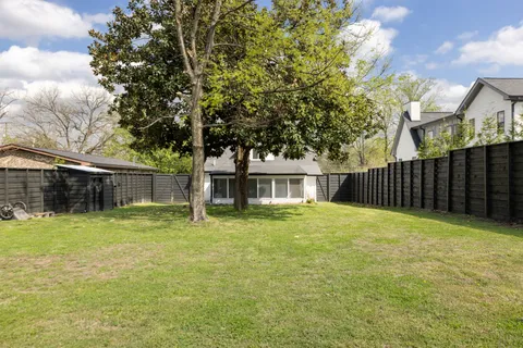 a house with trees in the background