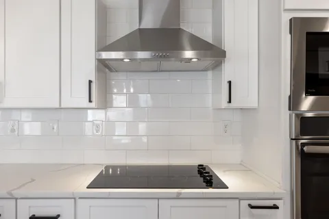 a kitchen with a sink and cabinets