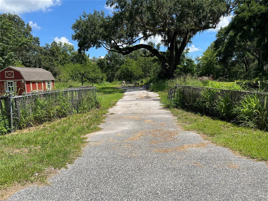 411 Alibrandi Road Leesburg, FL 34748 - Photo 29 of 44 an aerial view of a house