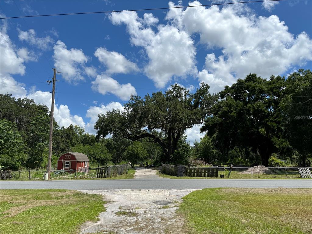 411 Alibrandi Road Leesburg, FL 34748 - Photo 35 of 44 a view of a house with a yard