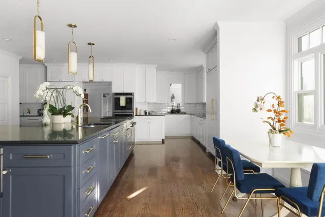 a kitchen with kitchen island granite countertop lots of counter top space and dining table