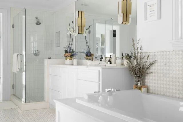 a bathroom with a double vanity sink a mirror and a shower