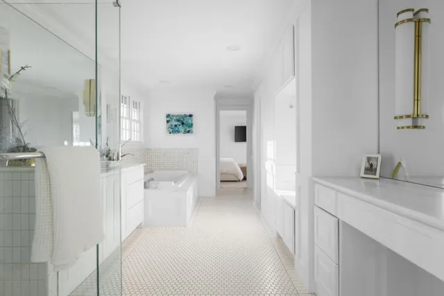 a en suite bathroom with a sink a mirror and a shower