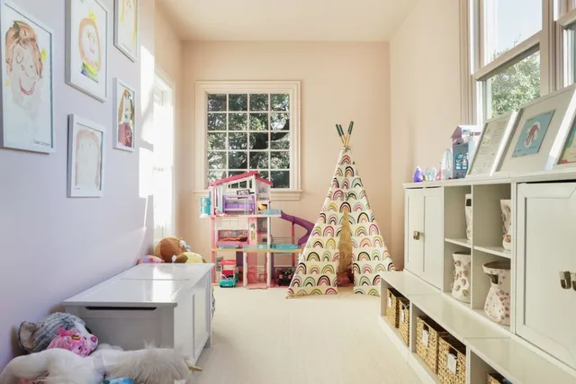 a bedroom with furniture and a window