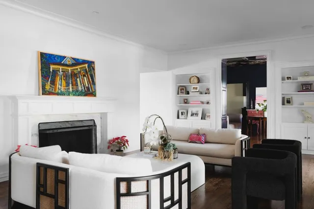 a living room with furniture and a fireplace