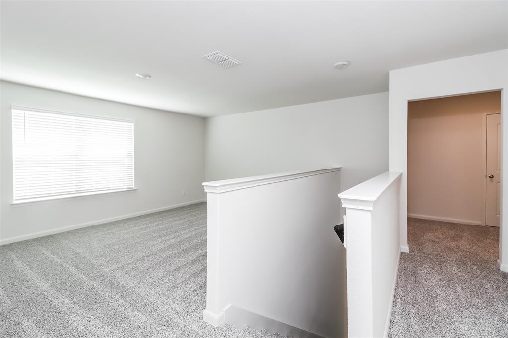 149 Switchback Hill Road Newark, TX 76071 - Photo 11 of 17 a view of an empty room with windows