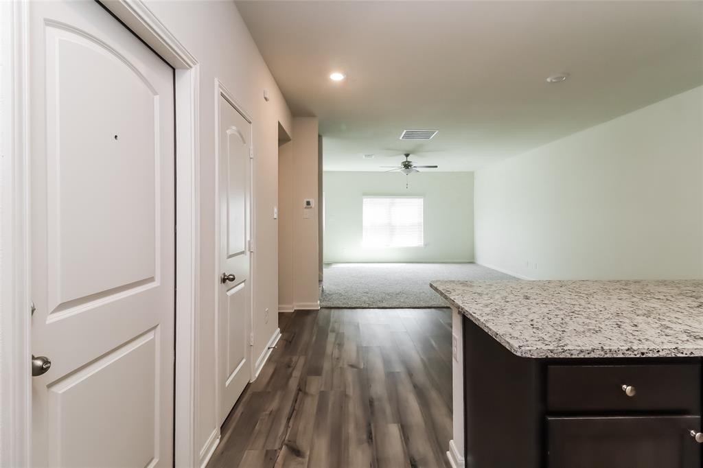 149 Switchback Hill Road Newark, TX 76071 - Photo 12 of 17 a view of hallway with granite countertop living room