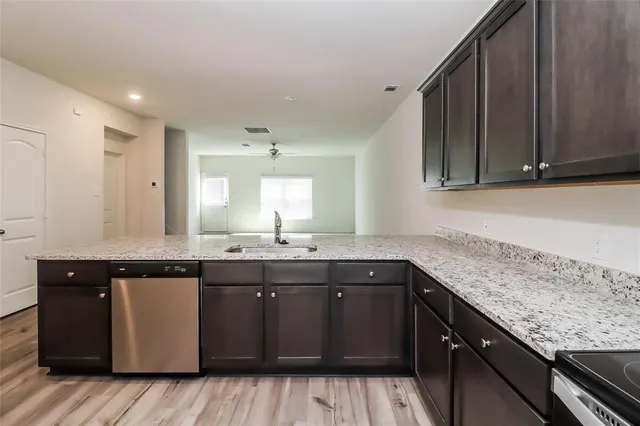 a kitchen with a sink and cabinets