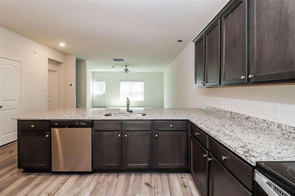 149 Switchback Hill Road Newark, TX 76071 - Photo 13 of 17 a kitchen with a sink and cabinets