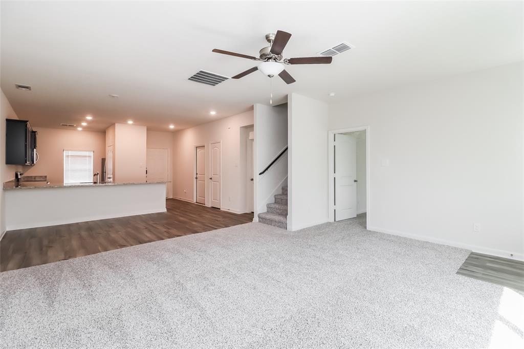 149 Switchback Hill Road Newark, TX 76071 - Photo 10 of 17 a view of an empty room with a ceiling fan