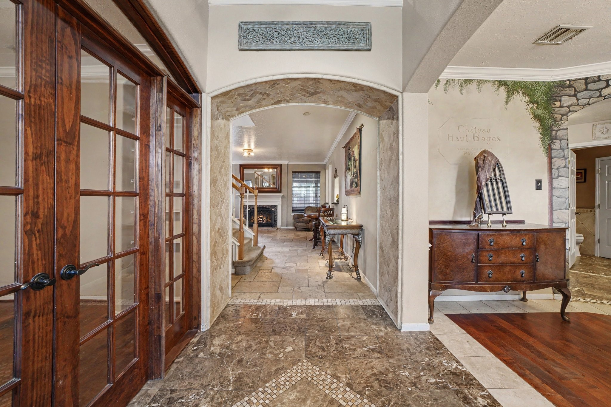 7918 Duncansby Vale Road Houston, TX 77095 - Photo 5 of 39 Open the door to an inviting home with lots of architectural details from the custom tile entry, to the tiled arched walkway to the double French doors!