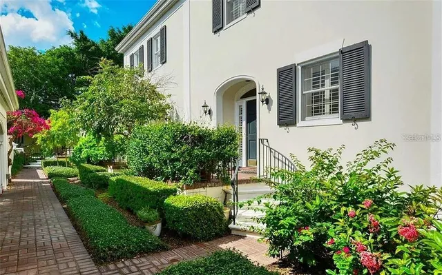 a front view of a house with garden