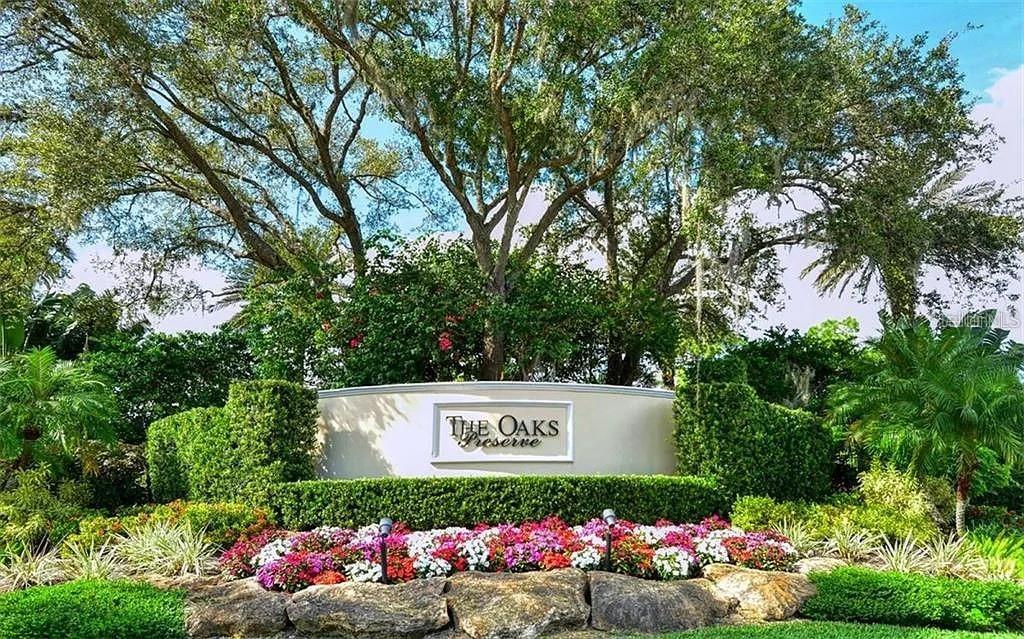 60 Bishopscourt Road, Unit 114 Osprey, FL 34229 - Photo 32 of 33 a view of sign board with a small yard