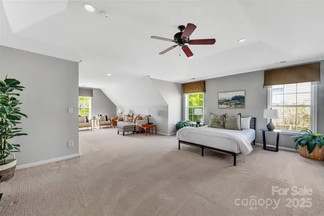 a living room with furniture and white walls