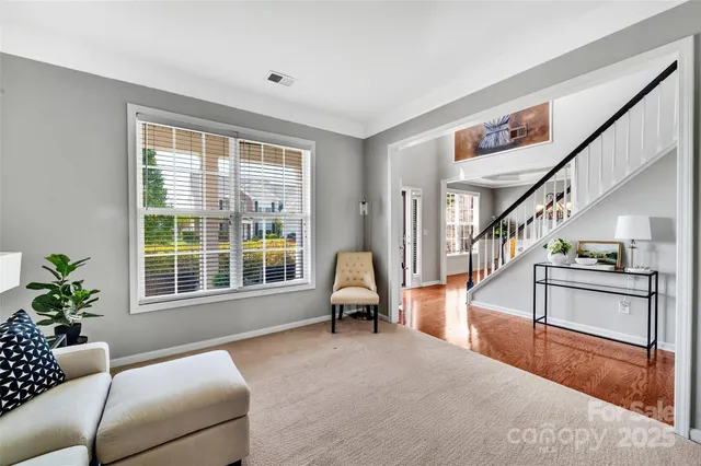 a living room with furniture and windows