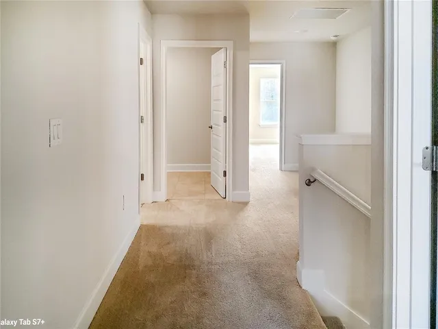 a view of a room with white walls