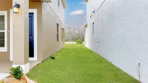a view of a patio with a yard
