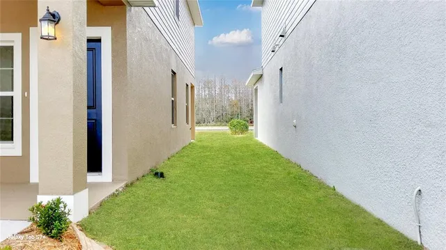 a view of a patio with a yard