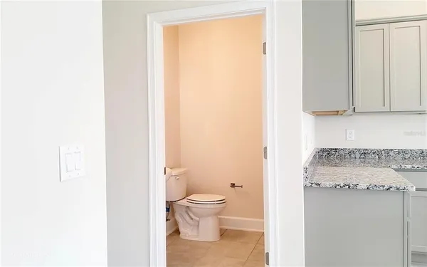 a bathroom with a toilet a sink and a shower