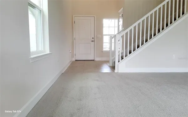 a view of a hallway with windows