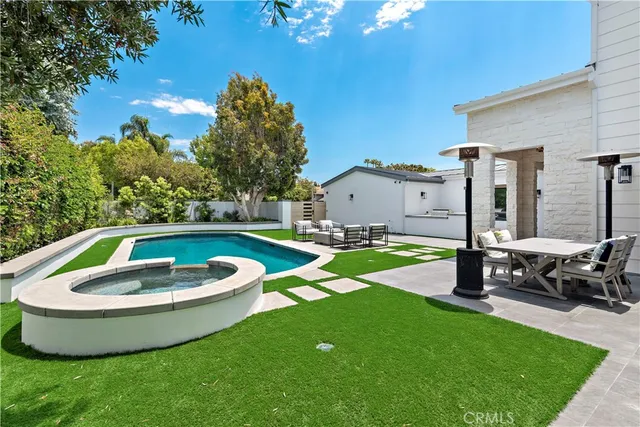 a view of a swimming pool with a patio