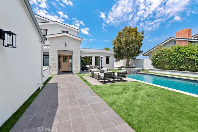 a outdoor space with swimming pool and furniture
