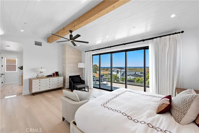 a large bathroom with a double vanity sink a large mirror and a bathtub