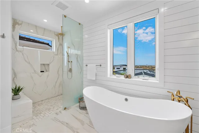 a large white bathroom with double vanity sink and a mirror