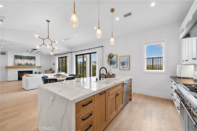 a kitchen with counter top space and stainless steel appliances