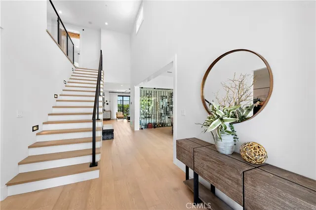 a dining room with furniture a chandelier and window