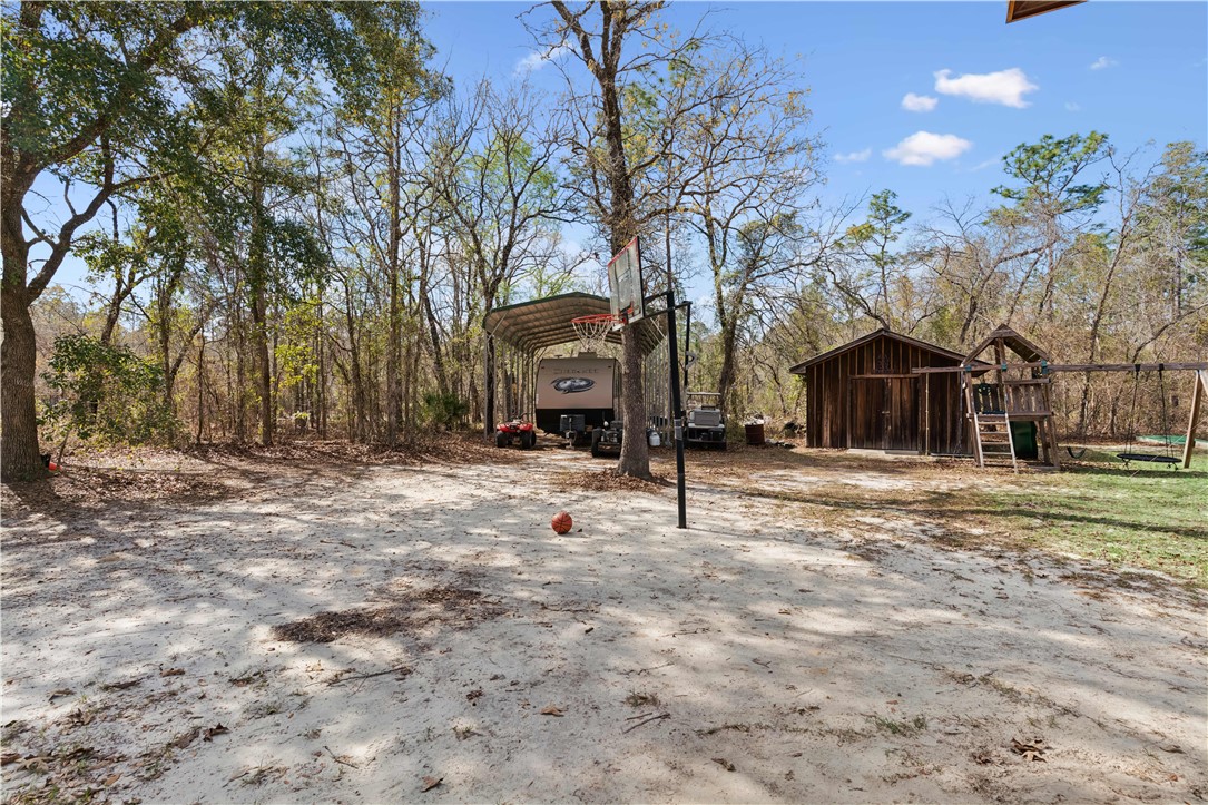 150 Baker Hill Road Hortense, GA 31543 - Photo 27 of 37 View of Basketball Goal, RV Carport, Storage Building.