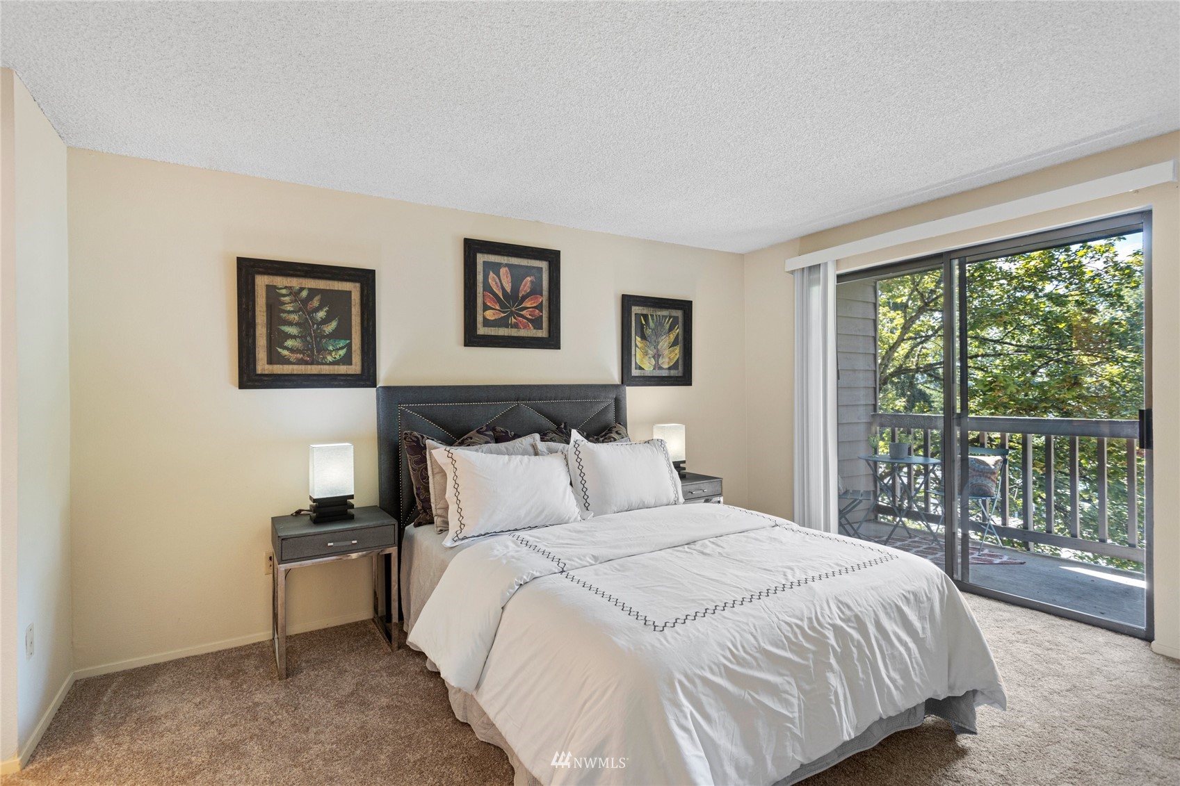 611 Southwest 5th Court, Unit A304 Renton, WA 98057 - Photo 16 of 23 a bedroom with a bed and a large window