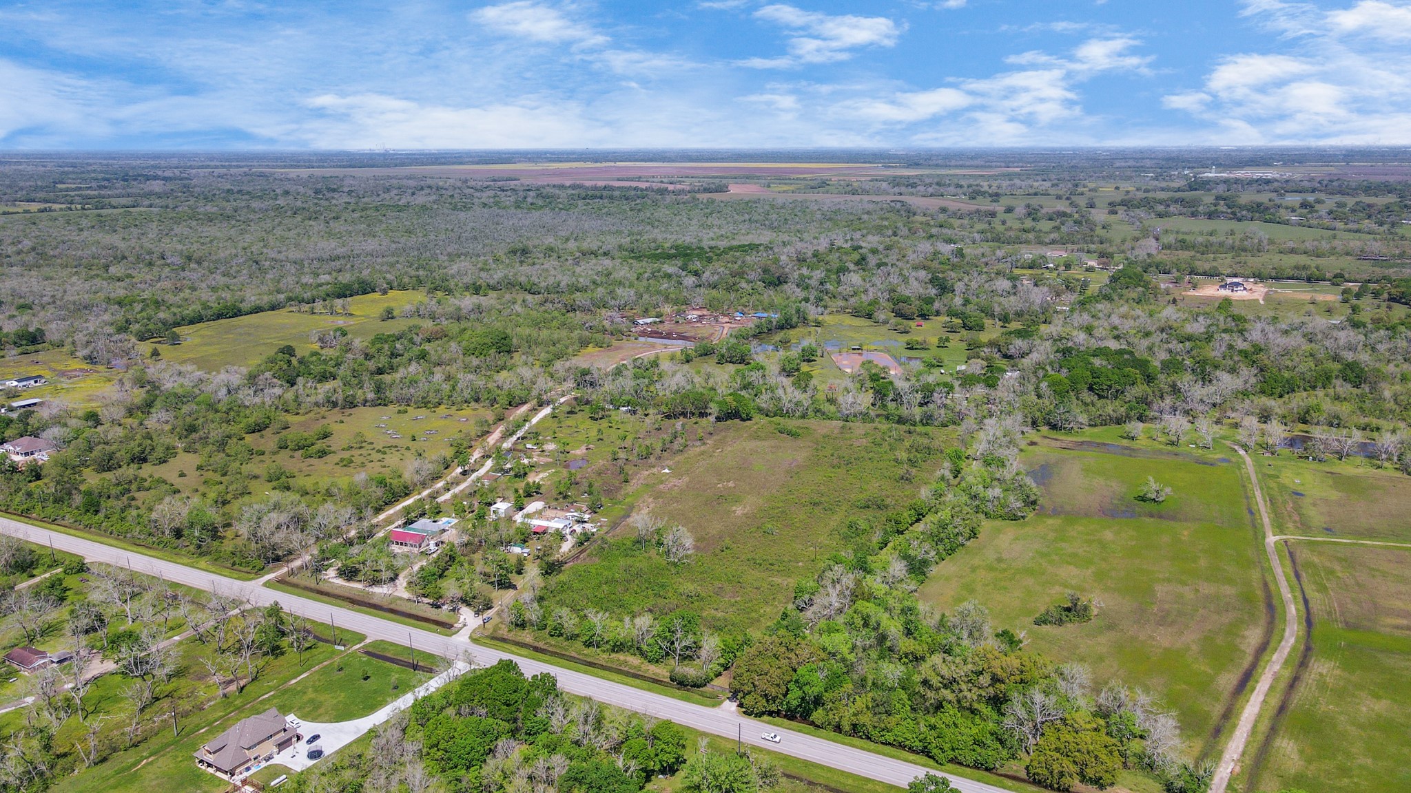 1720 West Fm 1462 Rosharon, TX 77583 - Photo 26 of 44 a view of a lake with a mountain in the background