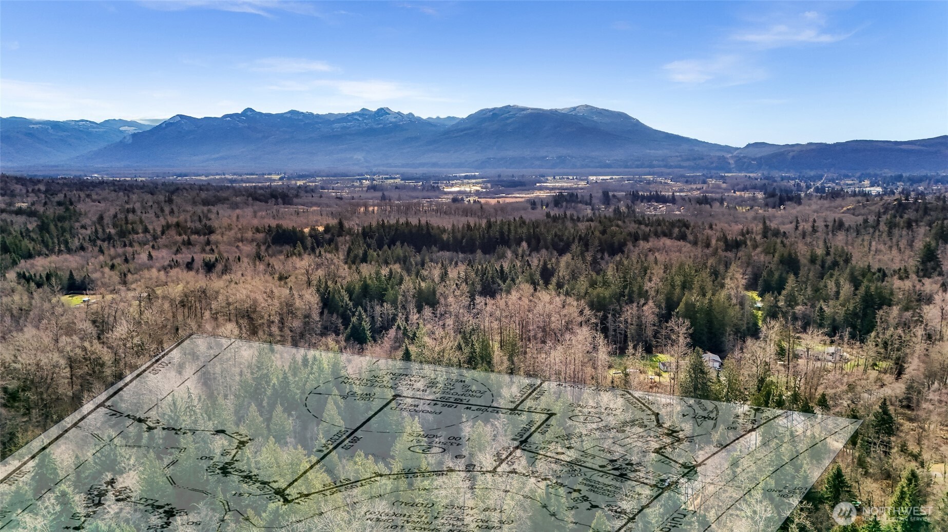 6657 North Fruitdale Road Sedro-Woolley, WA 98284 - Photo 13 of 19 a view of a lush green hillside and a building