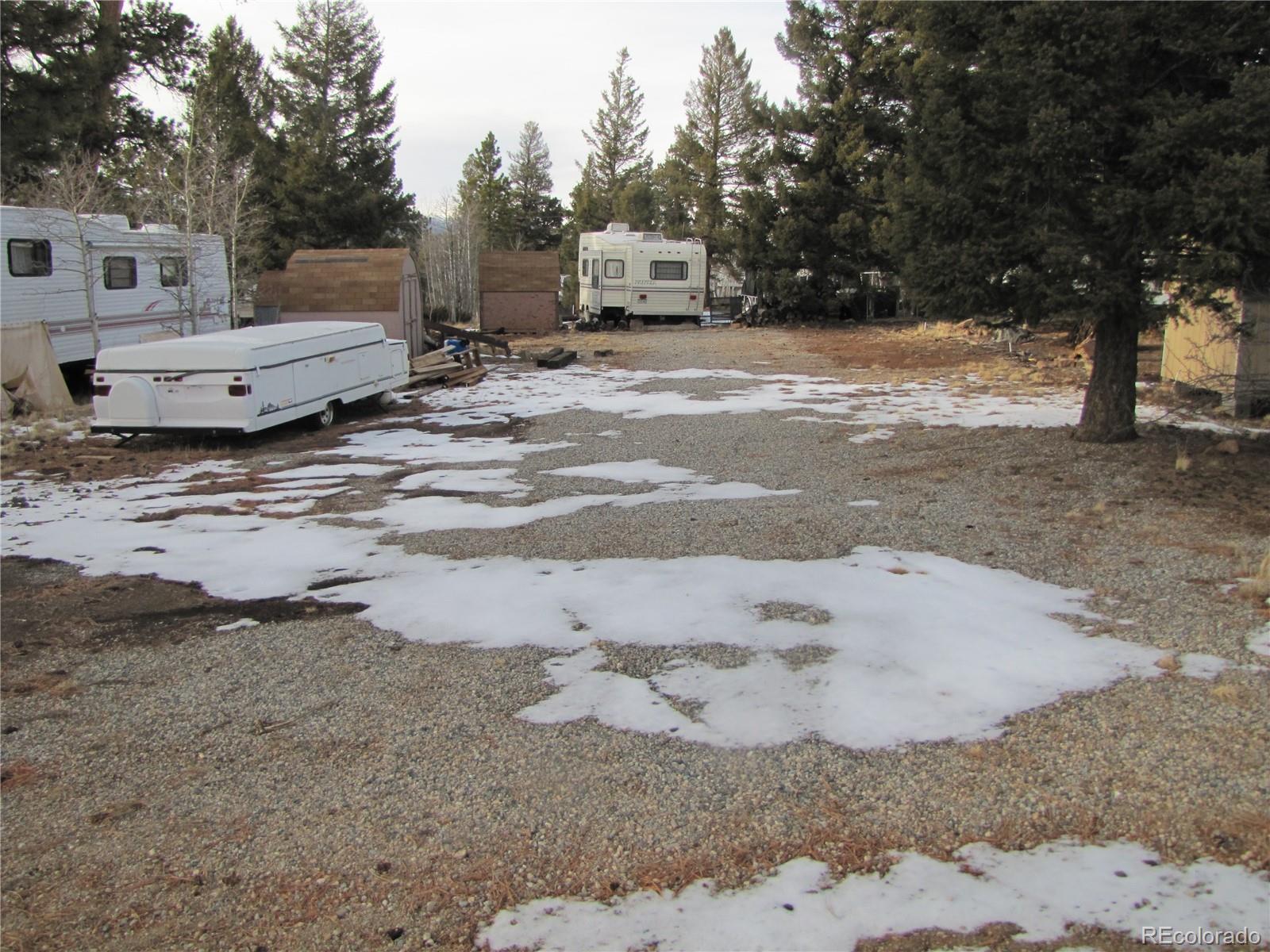158 Lantern Loop Fairplay, CO 80440 - Photo 3 of 12 a view of a dry yard with large trees