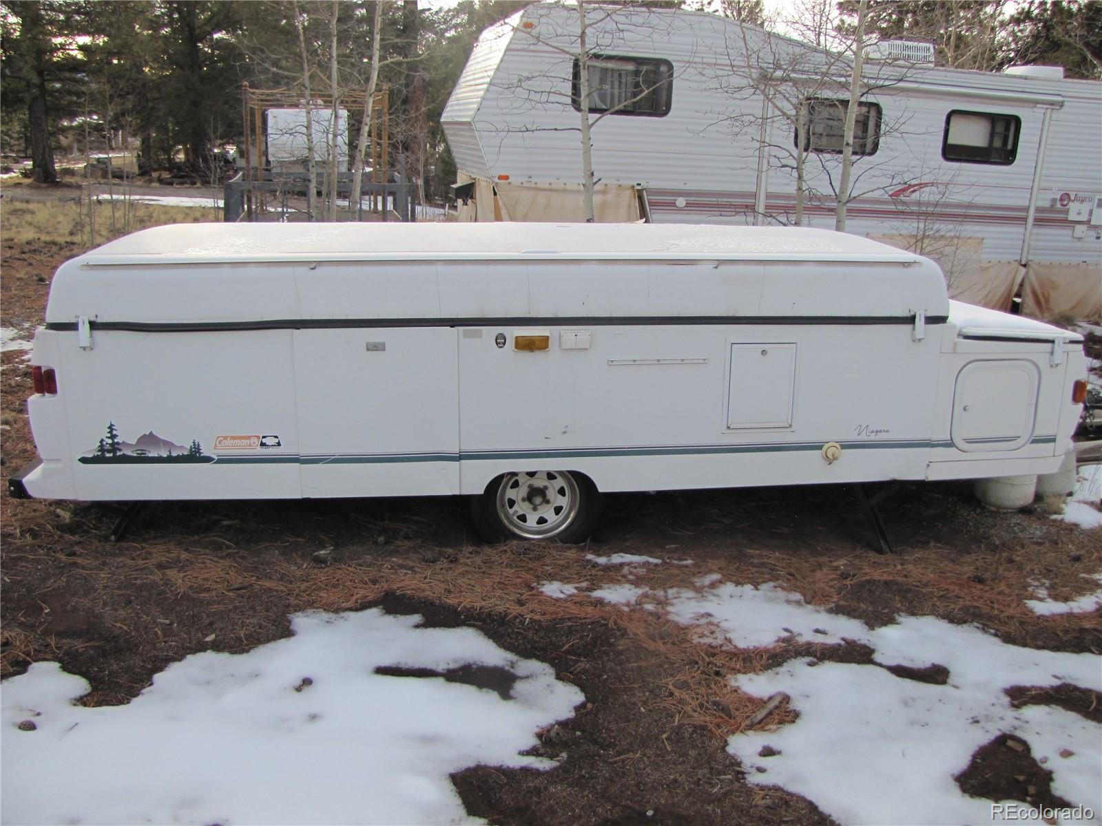158 Lantern Loop Fairplay, CO 80440 - Photo 4 of 12 a bathroom with a granite countertop sink and a mirror