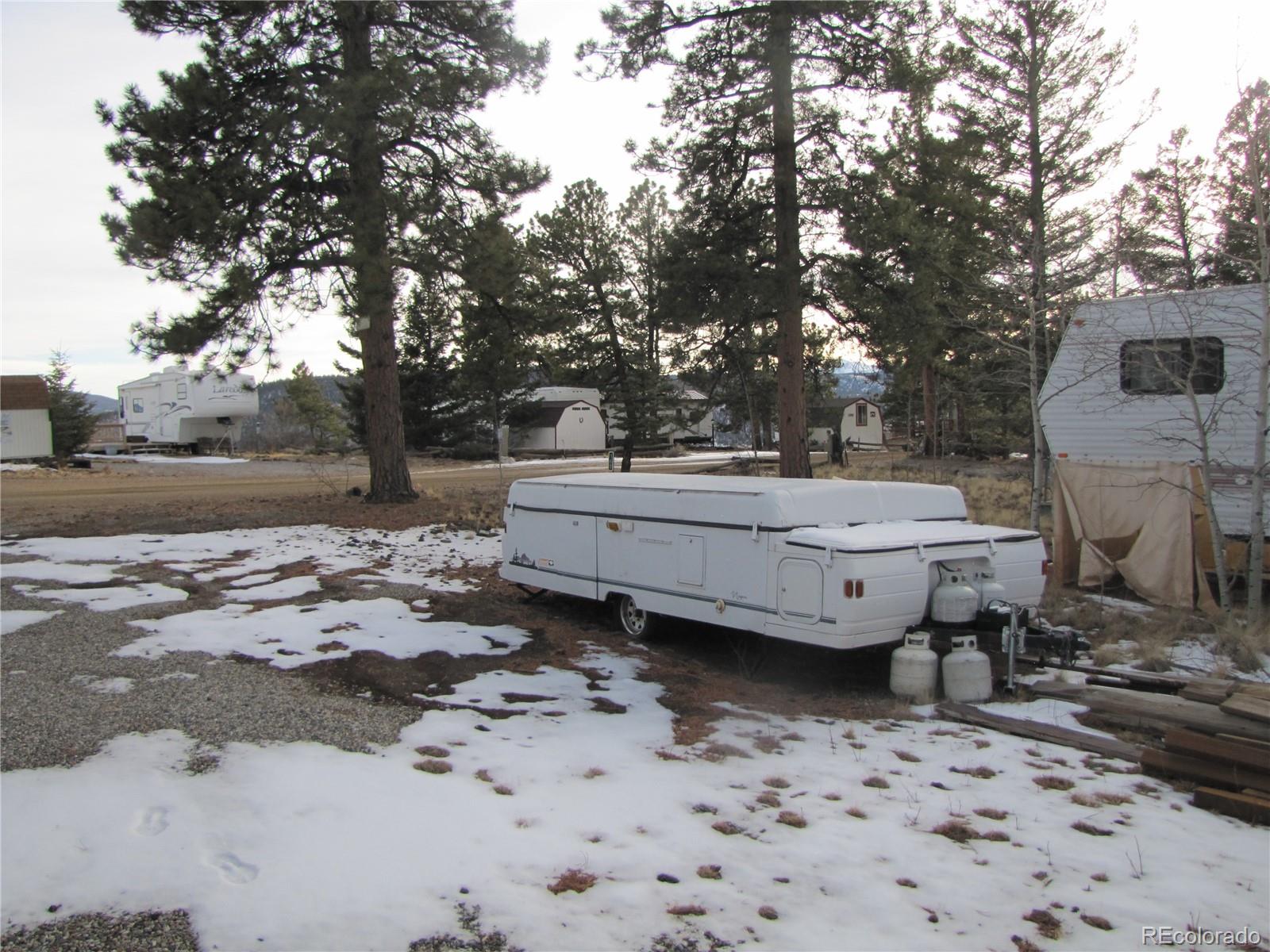 158 Lantern Loop Fairplay, CO 80440 - Photo 9 of 12 a backyard of a house with barbeque oven