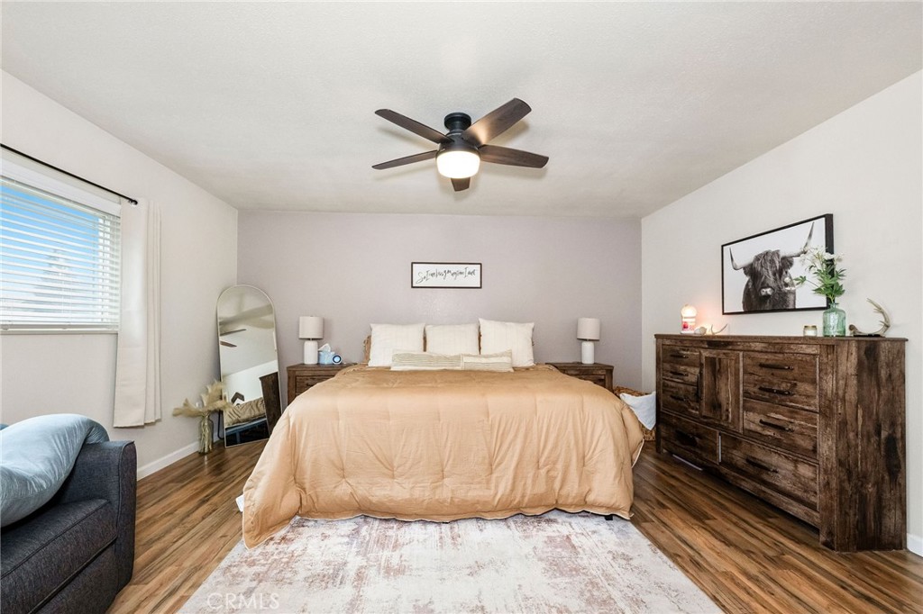 133 Tanner Way Orland, CA 95963 - Photo 15 of 25 a bedroom with a bed and wooden floor