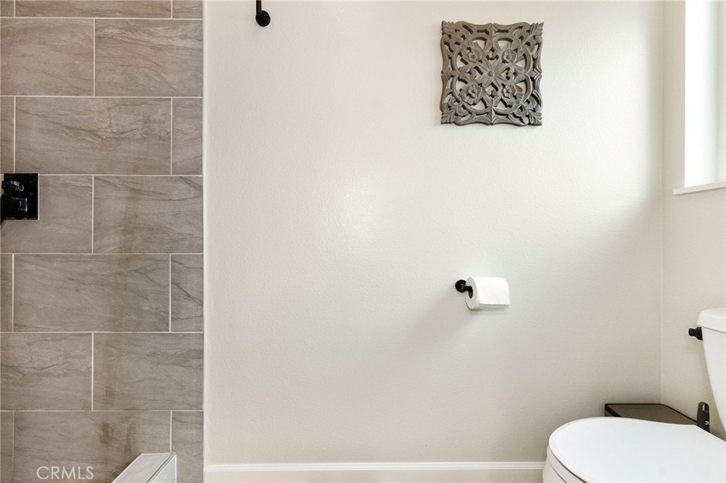 133 Tanner Way Orland, CA 95963 - Photo 17 of 25 a white toilet sitting next to a white wall
