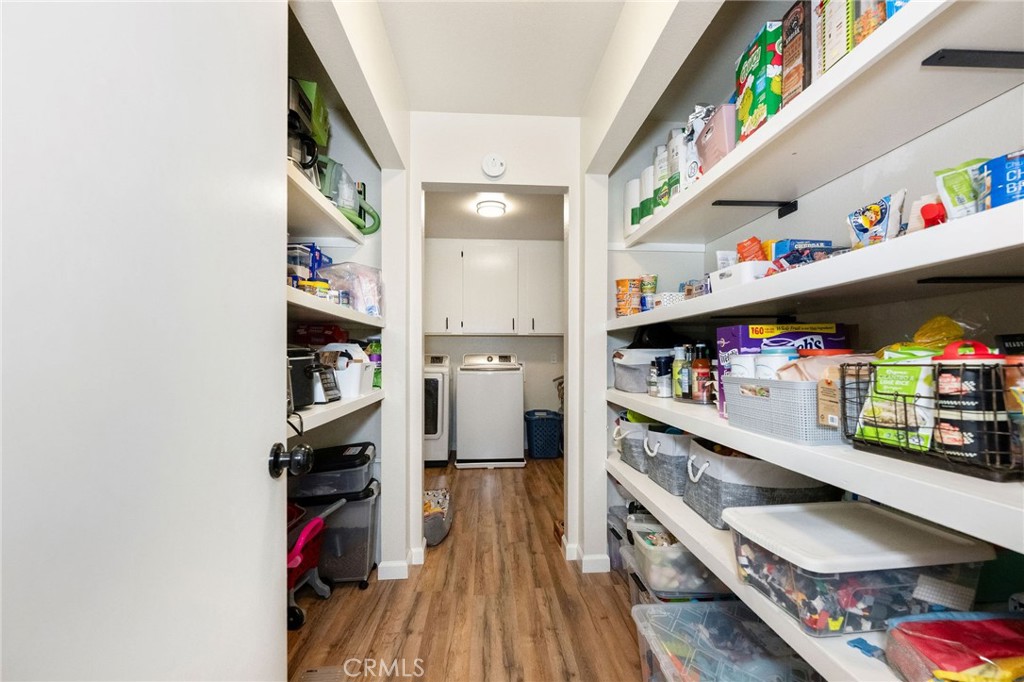 133 Tanner Way Orland, CA 95963 - Photo 19 of 25 a kitchen with stainless steel appliances cabinets and a wooden floor