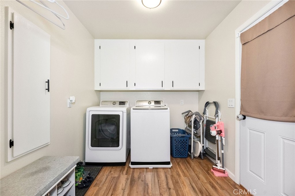 133 Tanner Way Orland, CA 95963 - Photo 20 of 25 a utility room with wooden floor washer and dryer