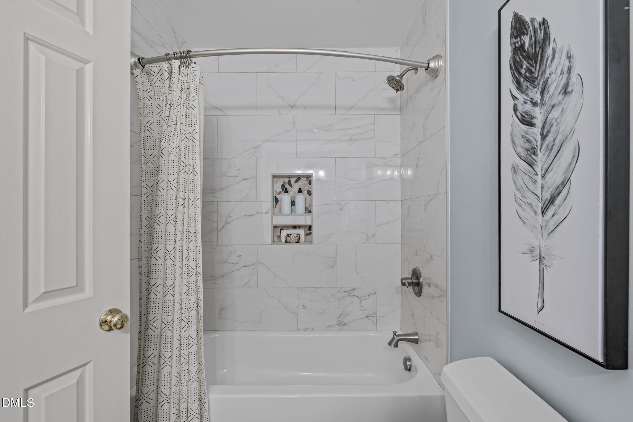 3304 Wade Avenue Raleigh, NC 27607 - Photo 24 of 38 a bathroom with a shower curtain and a bathtub