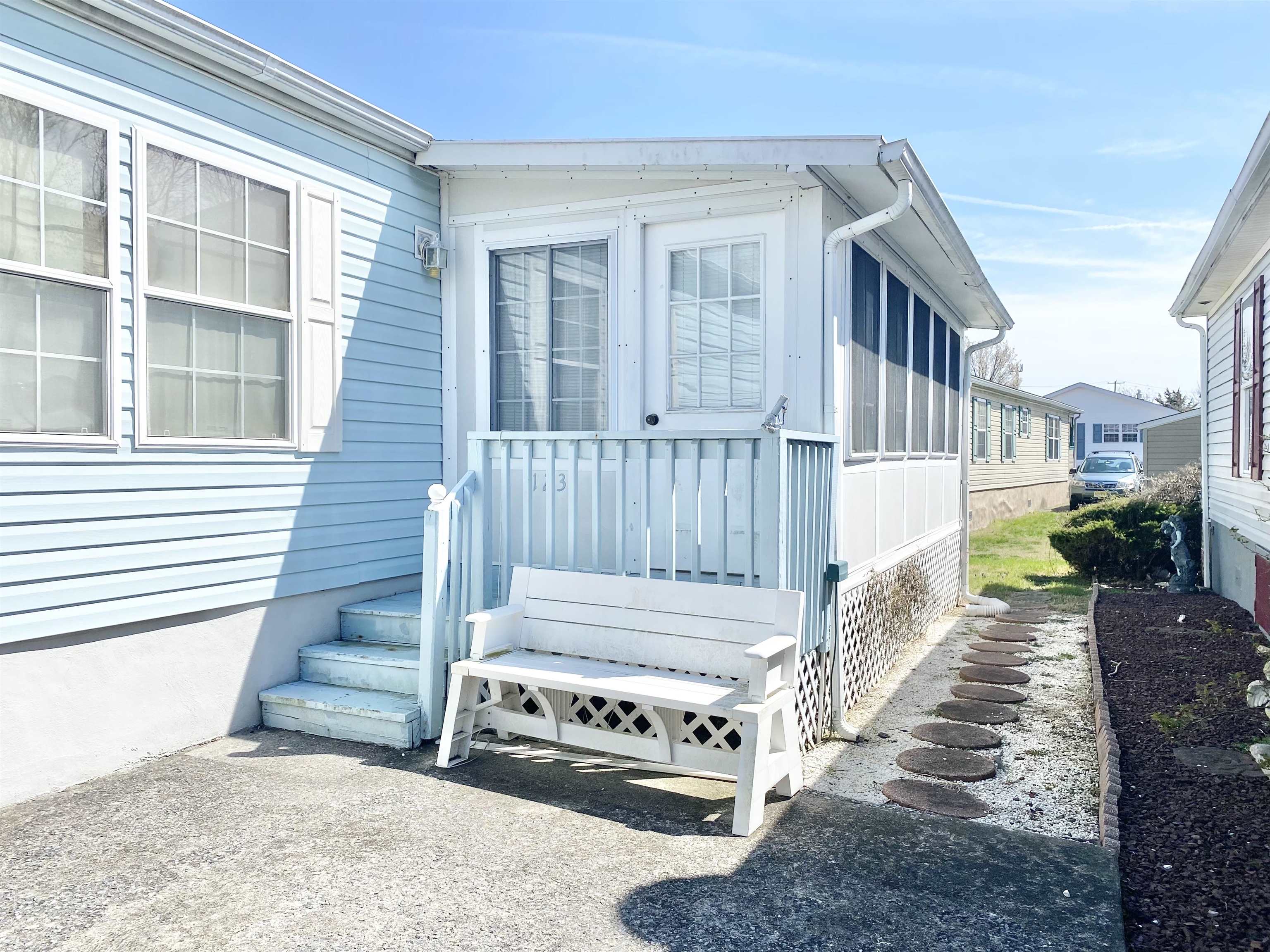 123 Shell North Cape May, NJ 08204 - Photo 2 of 29 a view of a house with a small yard and wooden floor and fence