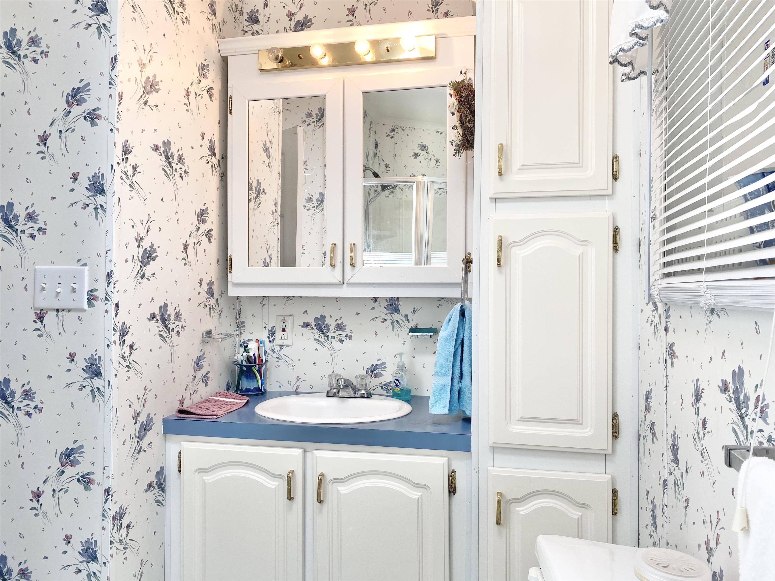123 Shell North Cape May, NJ 08204 - Photo 23 of 29 a bathroom with a sink and a mirror