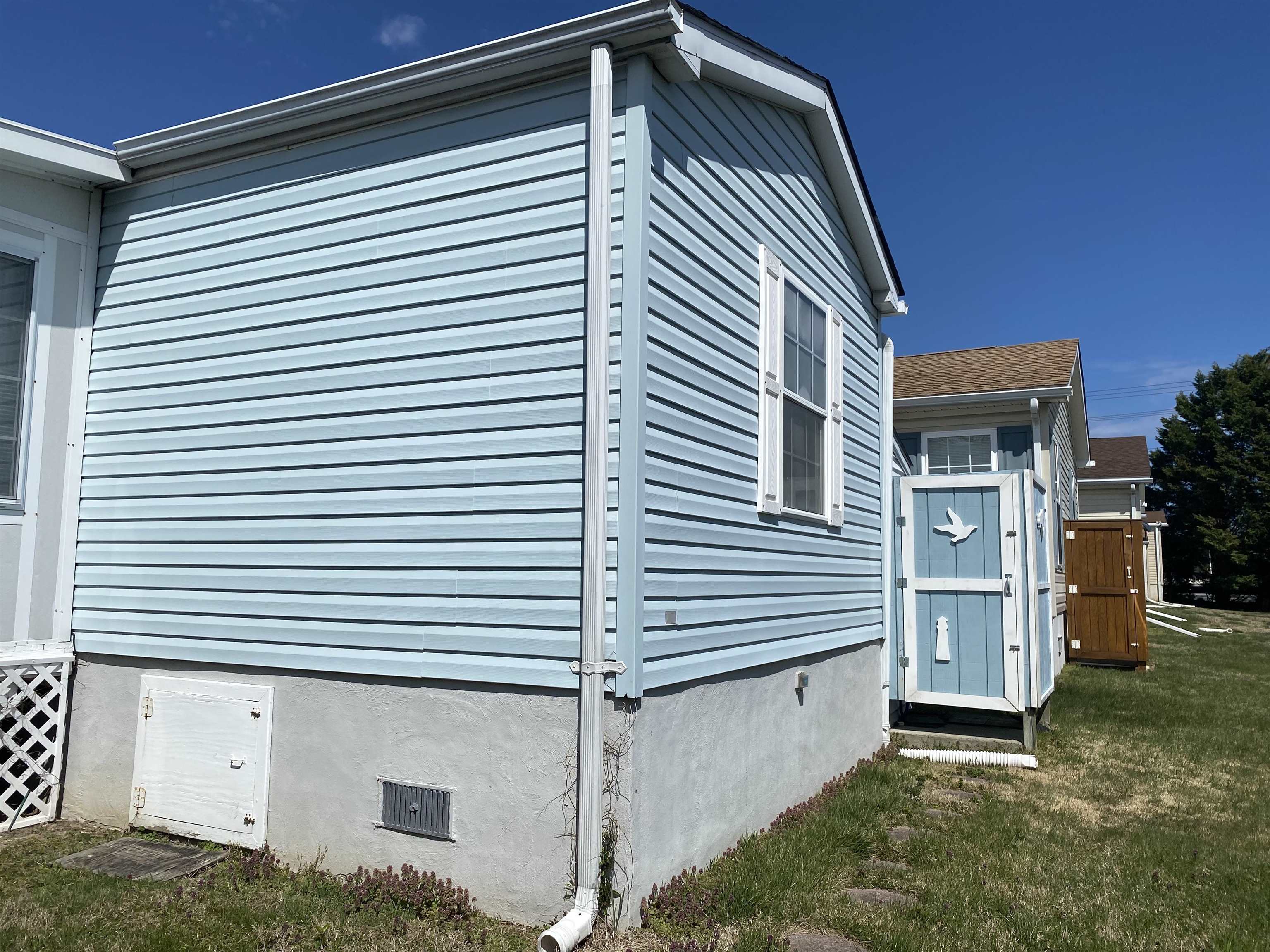 123 Shell North Cape May, NJ 08204 - Photo 3 of 29 a front view of a house with a garage