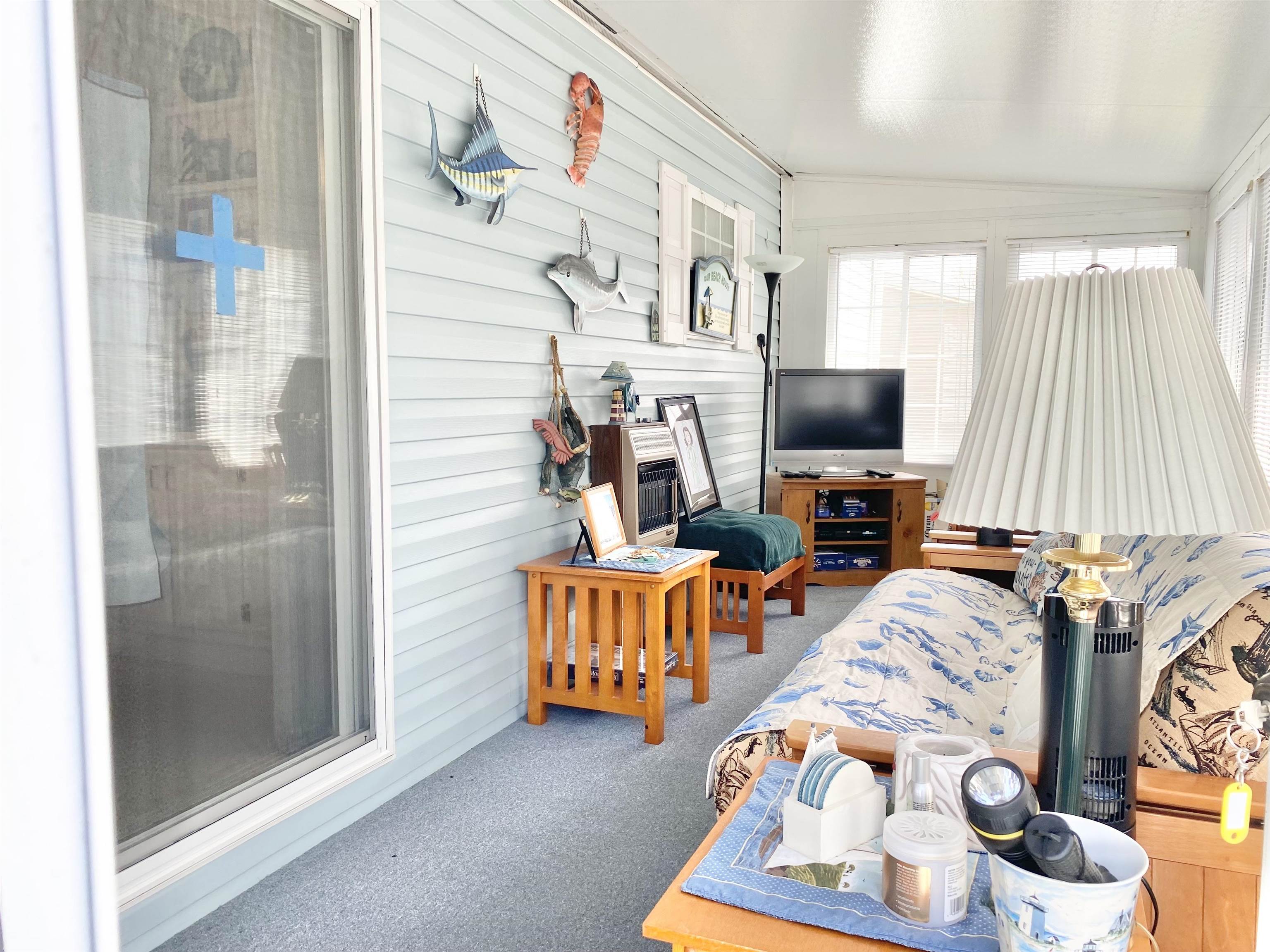 123 Shell North Cape May, NJ 08204 - Photo 5 of 29 a bedroom with furniture and a flat screen tv
