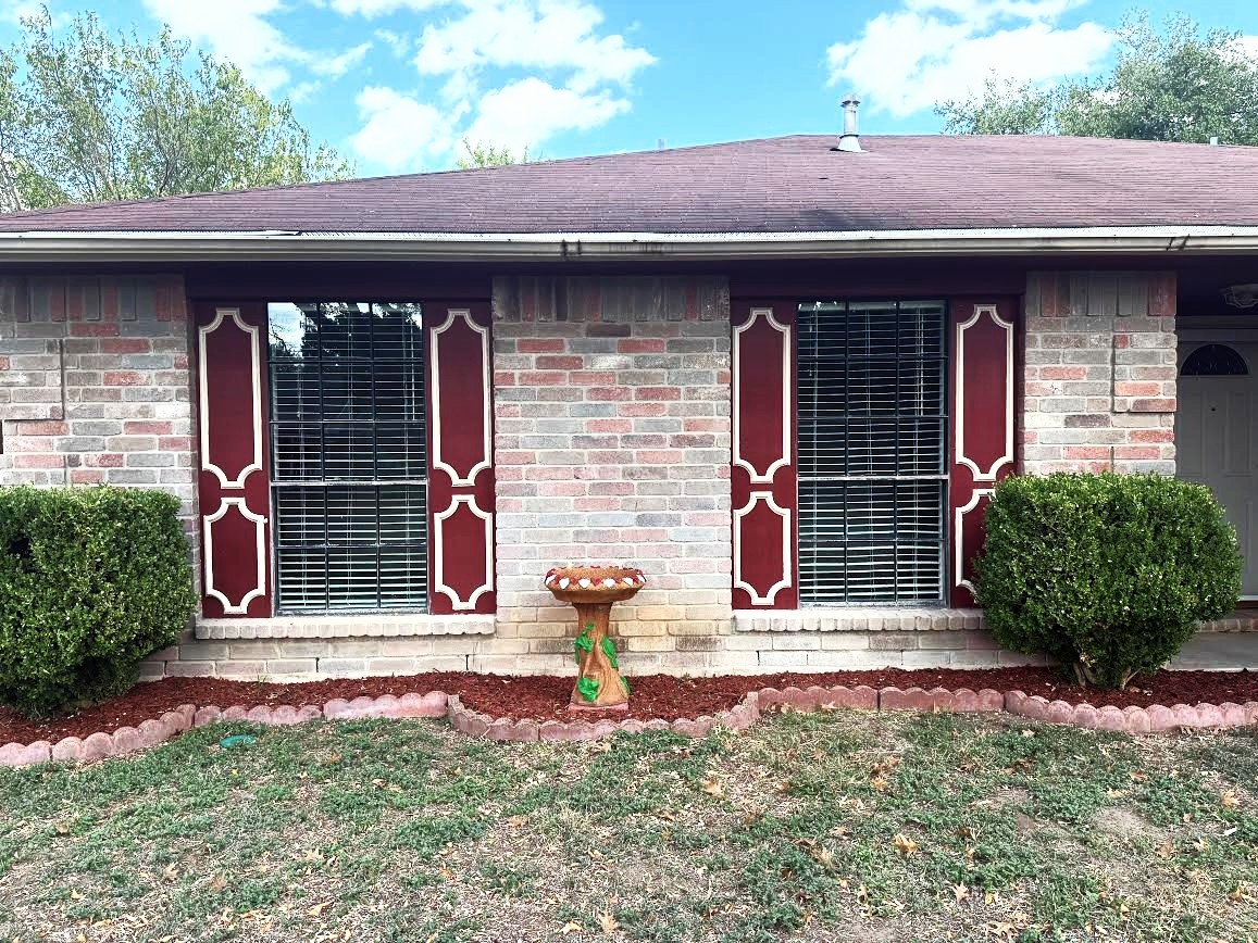 1412 Quail Run Road Pflugerville, TX 78660 - Photo 1 of 1 Brick front with red trim