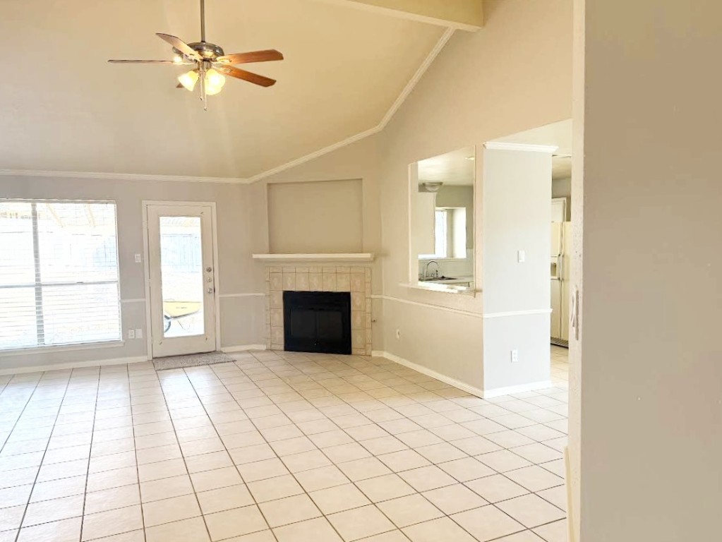 1412 Quail Run Road Pflugerville, TX 78660 - Photo 4 of 16 a view of an empty room with window and chandelier fan